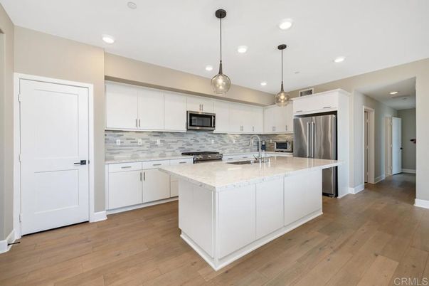Interior, Kitchen, Pendant Lights, Recessed Lighting, Stainless Steel Appliances, Wood Texture Flooring