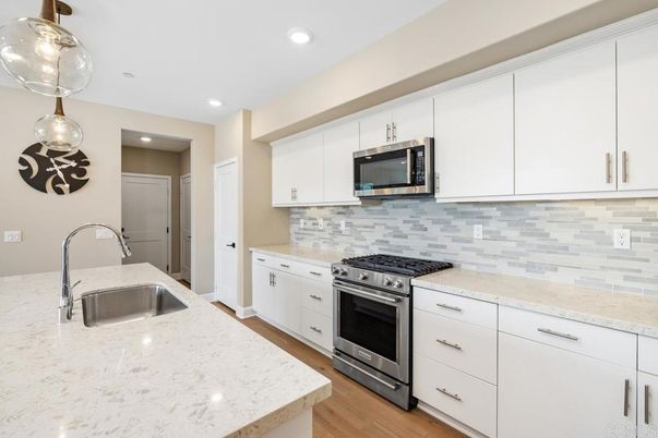Interior, Kitchen, Pendant Lights, Recessed Lighting, Stainless Steel Appliances, Wood Texture Flooring