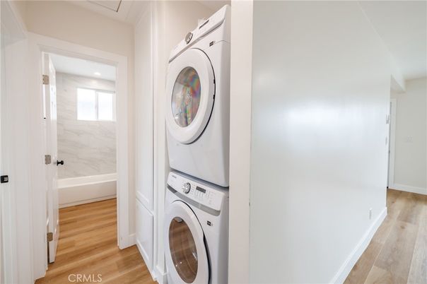Interior, Marble Walls, Recessed Lighting, Utility Closets, Washer, Wood Texture Flooring