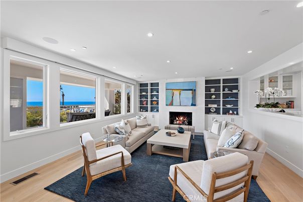 Fireplace, Interior, Living room, Recessed Lighting, Water, Wood Texture Flooring