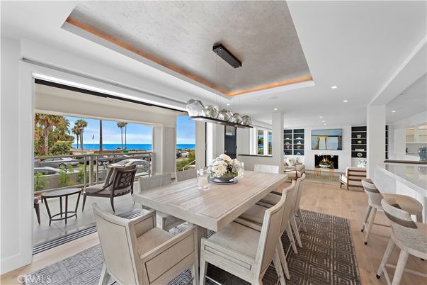 Dining room, Fireplace, Interior, Living room, Recessed Lighting, Water, Wood Texture Flooring