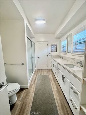 Bathroom, Dual Sink Vanities, Glass Shower, Interior, Wood Texture Flooring