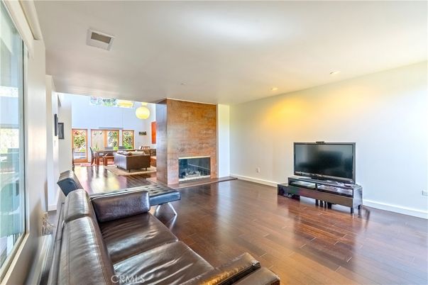 Dining room, Fireplace, Interior, Living room, Recessed Lighting, Wood Texture Flooring