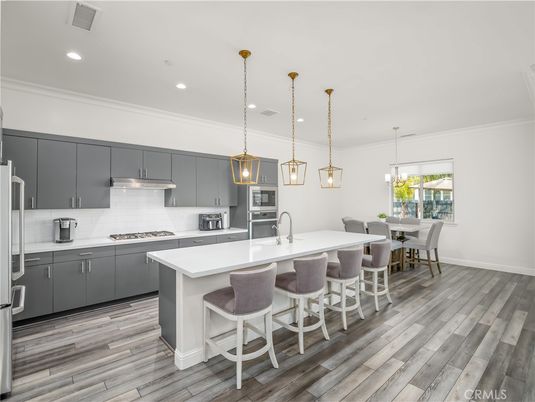 Dining room, Interior, Kitchen, Pendant Lights, Recessed Lighting, Stainless Steel Appliances, Wood Texture Flooring
