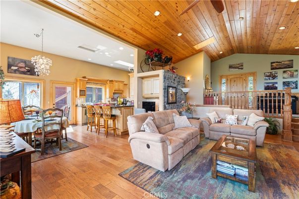 Chandelier, Dining room, Fireplace, Interior, Kitchen, Living room, Recessed Lighting, Wooden Ceilings, Wood Texture Flooring
