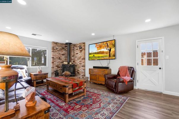 Fireplace, Interior, Recessed Lighting, Stone Walls, Wood Texture Flooring