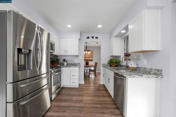 Dining room, Interior, Kitchen, Pendant Lights, Recessed Lighting, Stainless Steel Appliances, Wood Texture Flooring