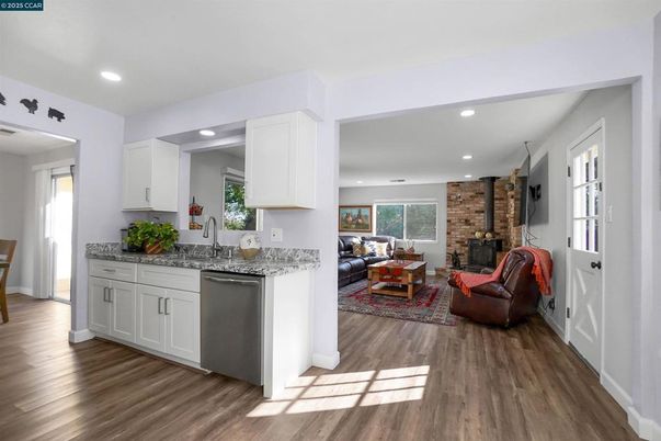 Fireplace, Interior, Kitchen, Living room, Recessed Lighting, Stone Walls, Wood Texture Flooring