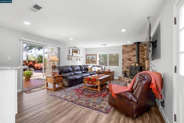 Fireplace, Interior, Living room, Recessed Lighting, Stone Walls, Wood Texture Flooring