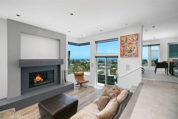 Dining room, Fireplace, Interior, Living room, Recessed Lighting, Water, Wood Texture Flooring