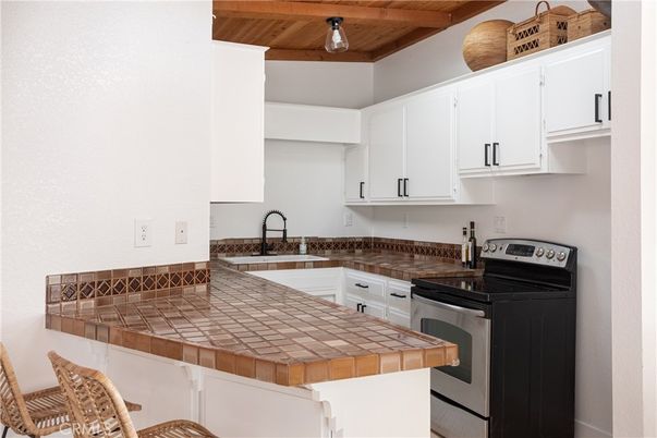 Interior, Kitchen, Tile Countertops, Wooden Ceilings