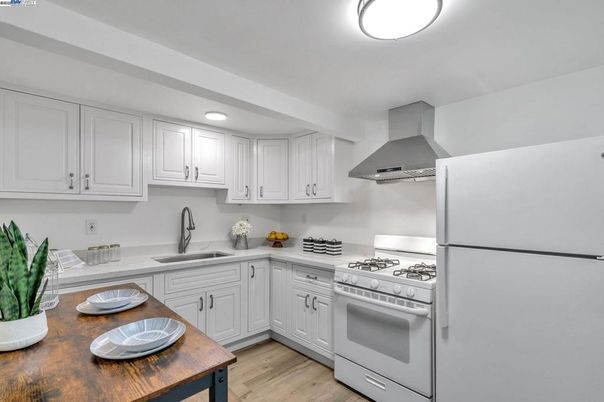Interior, Kitchen, Recessed Lighting, Stainless Steel Appliances, Wood Texture Flooring