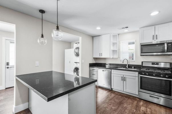 Interior, Kitchen, Pendant Lights, Recessed Lighting, Stainless Steel Appliances, Washer, Wood Texture Flooring
