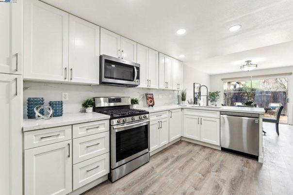 Dining room, Interior, Kitchen, Recessed Lighting, Stainless Steel Appliances, Wood Texture Flooring