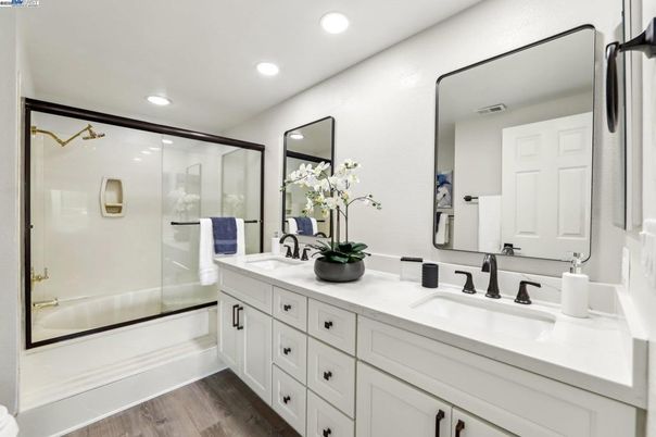 Bathroom, Dual Sink Vanities, Glass Shower, Interior, Recessed Lighting, Wood Texture Flooring