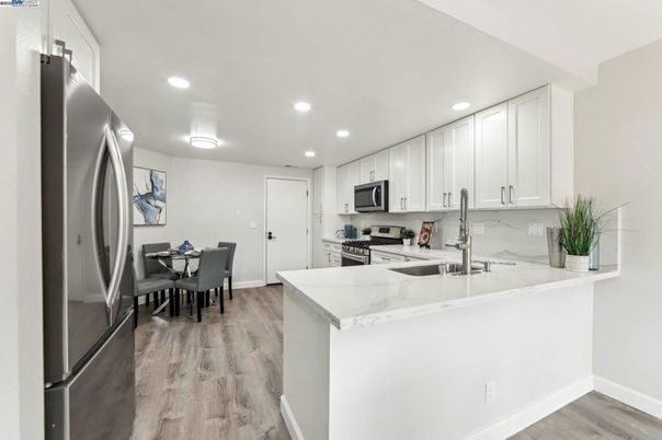 Dining room, Interior, Kitchen, Recessed Lighting, Stainless Steel Appliances, Wood Texture Flooring