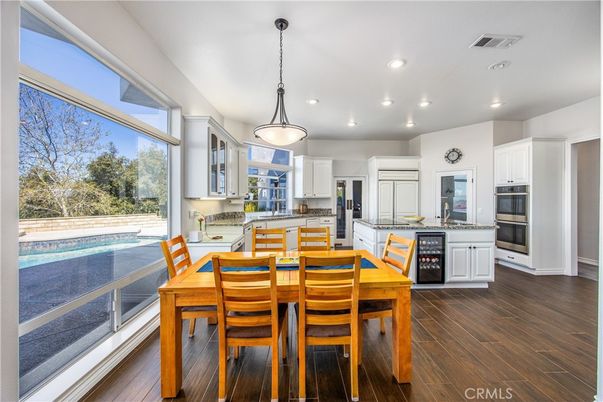 Dining room, Interior, Kitchen, Pendant Lights, Recessed Lighting, Stainless Steel Appliances, Wood Texture Flooring