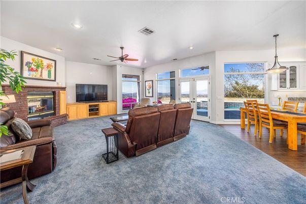 Dining room, Fireplace, Interior, Living room, Pendant Lights, Recessed Lighting, Wood Texture Flooring
