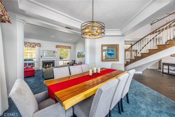 Dining room, Fireplace, Interior, Living room, Pendant Lights, Recessed Lighting, Wood Texture Flooring