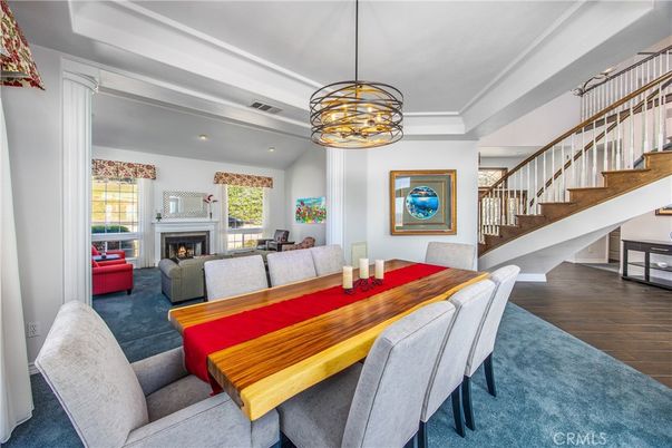 Dining room, Fireplace, Interior, Living room, Pendant Lights, Recessed Lighting, Wood Texture Flooring