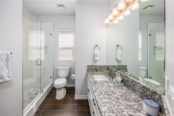 Bathroom, Dual Sink Vanities, Glass Shower, Interior, Wood Texture Flooring