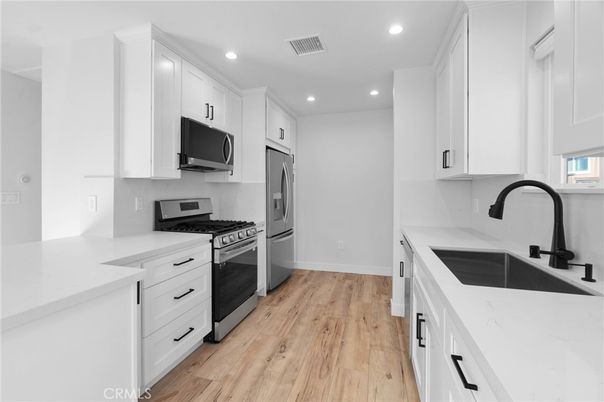 Interior, Kitchen, Recessed Lighting, Stainless Steel Appliances, Wood Texture Flooring