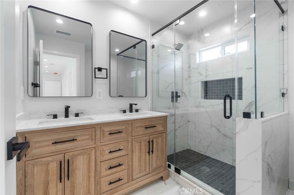 Bathroom, Dual Sink Vanities, Glass Shower, Interior, Marble, Marble Walls, Recessed Lighting