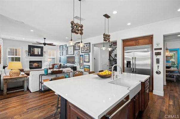 Fireplace, Interior, Kitchen, Living room, Pendant Lights, Recessed Lighting, Stainless Steel Appliances, Wood Texture Flooring