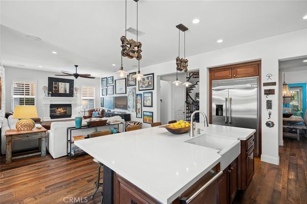 Fireplace, Interior, Kitchen, Living room, Pendant Lights, Recessed Lighting, Stainless Steel Appliances, Wood Texture Flooring