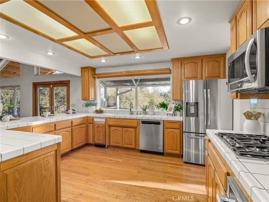 Interior, Kitchen, Recessed Lighting, Stainless Steel Appliances, Tile Countertops, Wood Texture Flooring