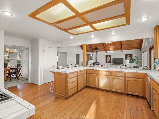 Chandelier, Dining room, Interior, Kitchen, Recessed Lighting, Tile Countertops, Wooden Beams, Wood Texture Flooring