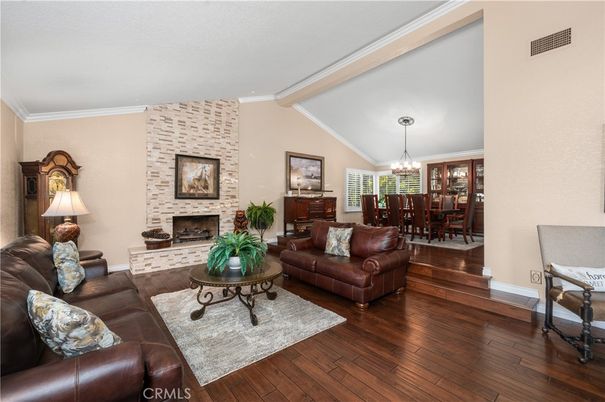 Chandelier, Dining room, Fireplace, Interior, Living room, Stone Walls, Wood Texture Flooring