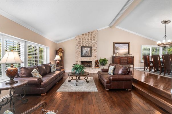 Chandelier, Dining room, Fireplace, Interior, Living room, Stone Walls, Wood Texture Flooring
