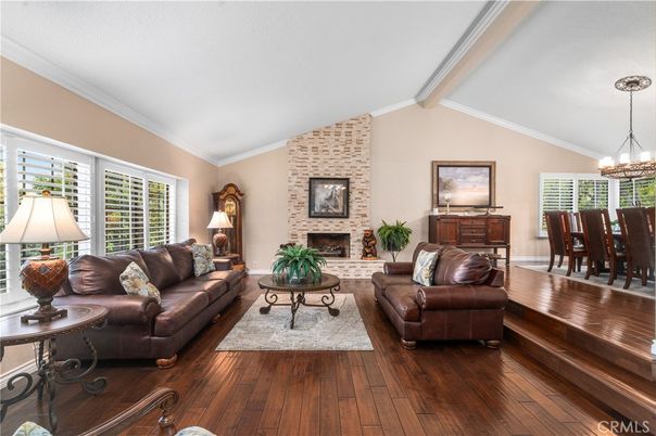 Chandelier, Dining room, Fireplace, Interior, Living room, Stone Walls, Wood Texture Flooring