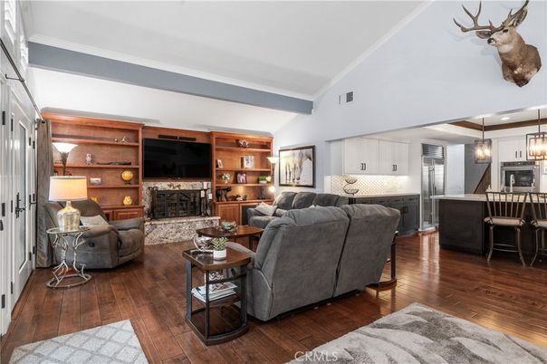 Fireplace, Interior, Kitchen, Living room, Pendant Lights, Stainless Steel Appliances, Wood Texture Flooring