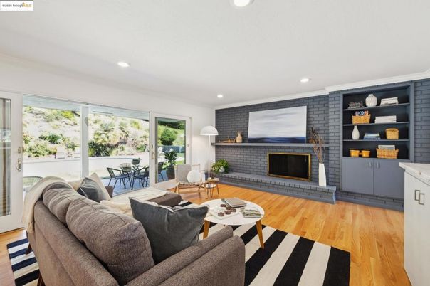 Fireplace, Interior, Living room, Recessed Lighting, Stone Walls, Wood Texture Flooring