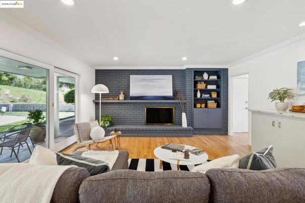 Fireplace, Interior, Living room, Recessed Lighting, Stone Walls, Wood Texture Flooring
