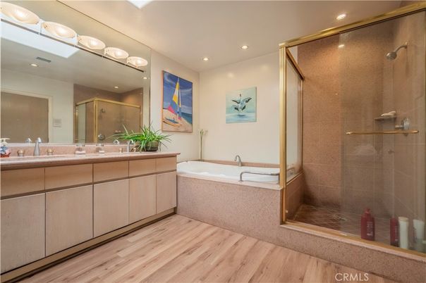 Bathroom, Dual Sink Vanities, Glass Shower, Interior, Recessed Lighting, Wood Texture Flooring