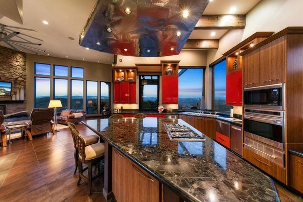 Dining room, Interior, Kitchen, Living room, Recessed Lighting, Stainless Steel Appliances, Stone Walls, Water, Wooden Beams