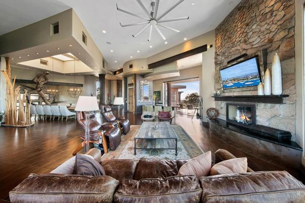 Chandelier, Dining room, Fireplace, Interior, Living room, Pendant Lights, Recessed Lighting, Stone Walls, Wood Texture Flooring