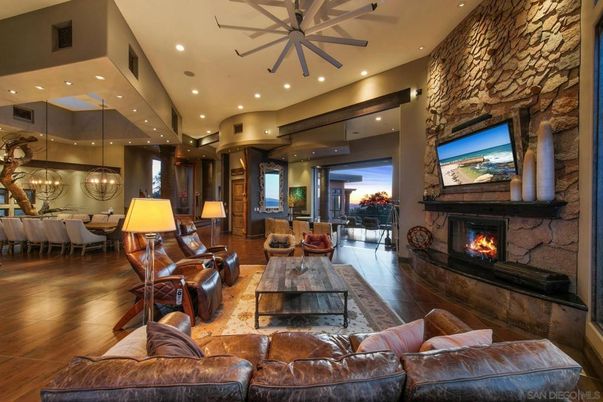 Chandelier, Dining room, Fireplace, Interior, Living room, Pendant Lights, Recessed Lighting, Stone Walls, Wood Texture Flooring