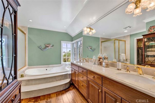 Bathroom, Dual Sink Vanities, Glass Shower, Interior, Recessed Lighting, Wood Texture Flooring
