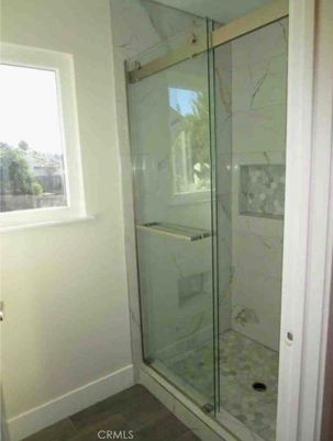 Bathroom, Glass Shower, Interior, Marble Walls, Wood Texture Flooring
