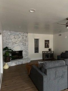 Fireplace, Interior, Living room, Recessed Lighting, Stone Walls, Wood Texture Flooring