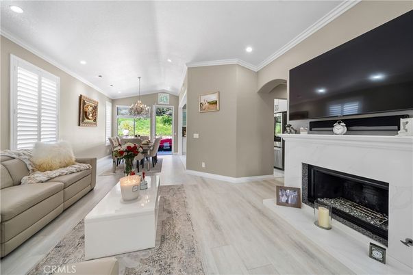 Chandelier, Dining room, Fireplace, Interior, Living room, Recessed Lighting, Wood Texture Flooring