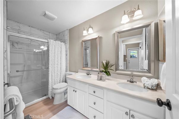 Bathroom, Dual Sink Vanities, Glass Shower, Interior, Wood Texture Flooring