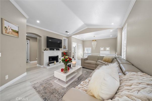 Chandelier, Fireplace, Interior, Living room, Recessed Lighting, Wood Texture Flooring