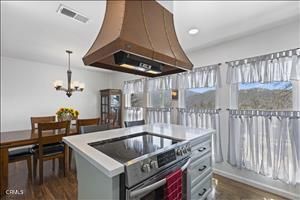 Chandelier, Dining room, Interior, Kitchen, Recessed Lighting, Stainless Steel Appliances, Wood Texture Flooring
