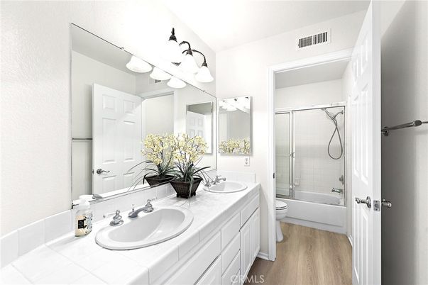 Bathroom, Dual Sink Vanities, Glass Shower, Interior, Tile Countertops, Wood Texture Flooring