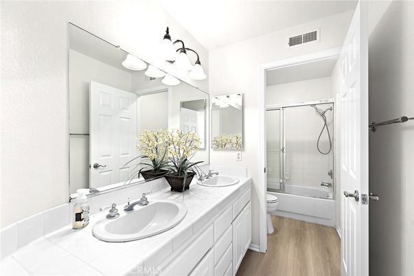 Bathroom, Dual Sink Vanities, Glass Shower, Interior, Tile Countertops, Wood Texture Flooring